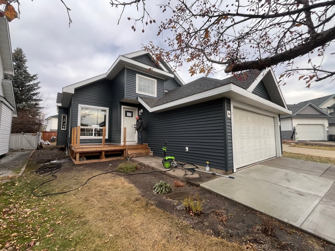 Home finished with siding, deck, and roofline complete
