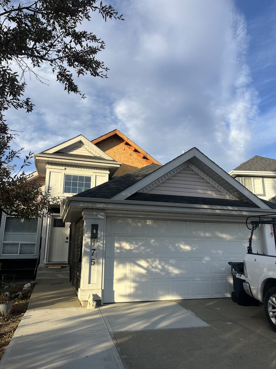 Same home mid-project with exposed sheathing